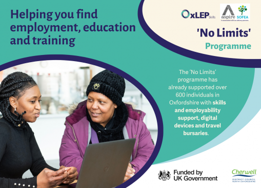 Image of individual seeking employability support, sat looking at laptop with other individual offering guidance